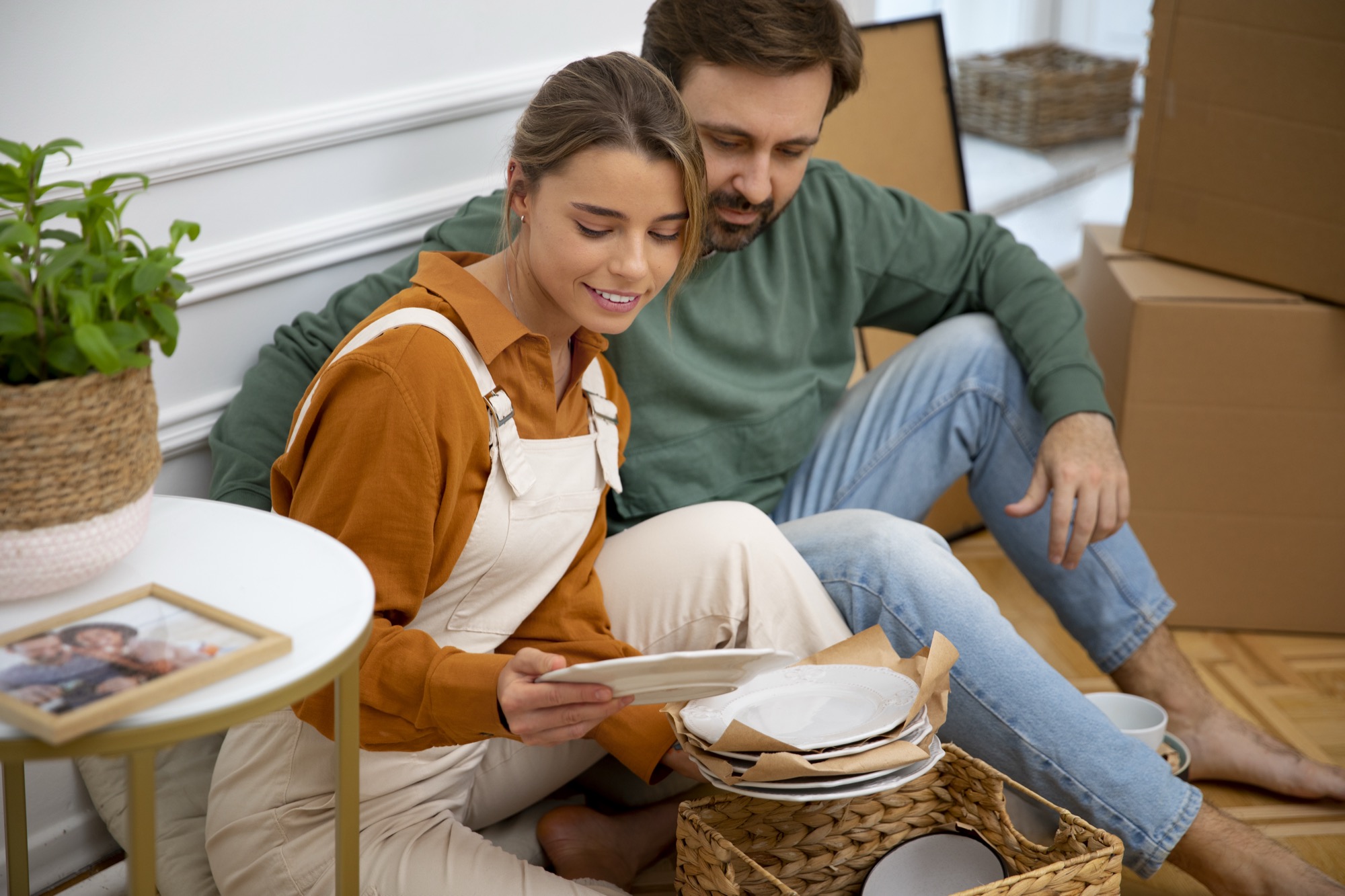 A young couple settling into their new home together.